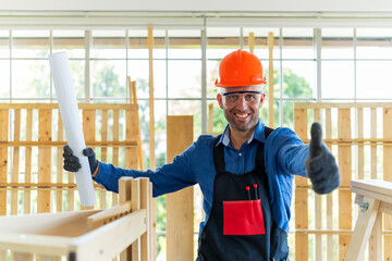 Happy man showing his DIY wood furniture made at home