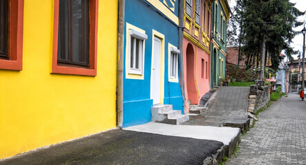 Fototapeta na wymiar Bright buildings in Sighisoara, Romania