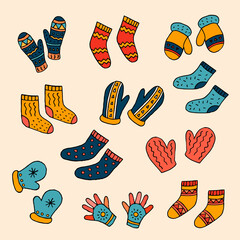 A set of warm socks and knitted mittens. Vector hand-drawn doodle illustration