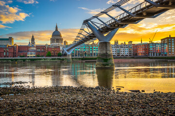 Millennium Bridge and St. Paul's cathedral dome at sunrise