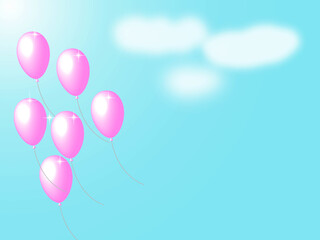 空へ飛んでいくピンク色の風船