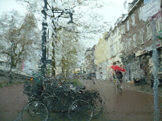 rain behind the glass on the street of the city of the Netherlands