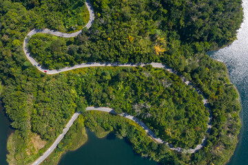 aerial view road along mea suai dam connecting the city
