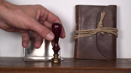 antique vintage retro stamp in a notary and lawyer office - sign a contract and stamp the agreement with sealing wax - Powered by Adobe