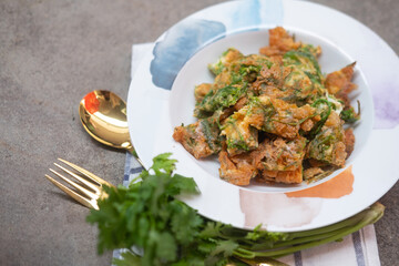 Fried acacia pennata omelet or cha-om egg