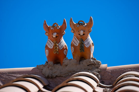 Peru typical traditional house protection on the roof. Two bulls named toritos