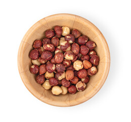 Hazelnuts in a wooden bowl on a white background, top view