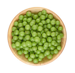 Indian gooseberry in a separate wooden bowl on a white background, top view