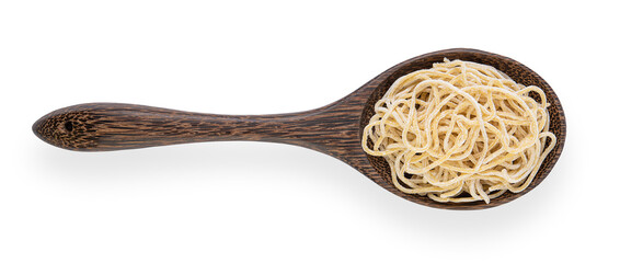 Raw noodles in a wooden spoon isolated on white background. Top view