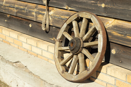 Old wooden wheel from a chariot with copy space