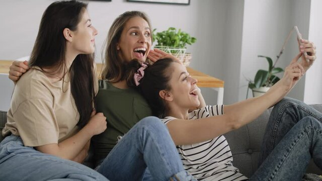 Video of three best friends taking selfie at home. Shot with RED helium camera in 8K.