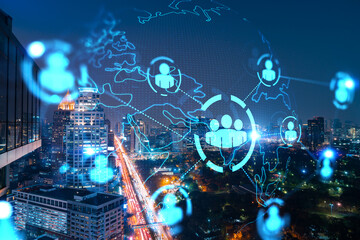 Glowing Social media icons on night panoramic city view of Bangkok, Asia. The concept of networking and establishing new connections between people and businesses. Double exposure.