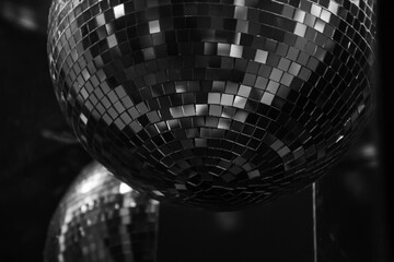 Mirror disco ball holiday decoration. Glow and reflection. Retro festive background. Nightlife...