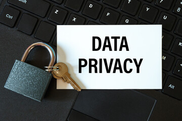 Data privacy - the inscription on the card and the lock on the background of the keyboard
