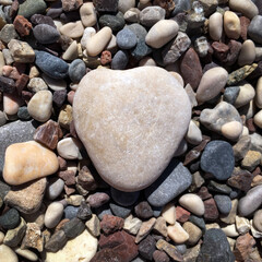 Rock heart on other natural stones, background, square image