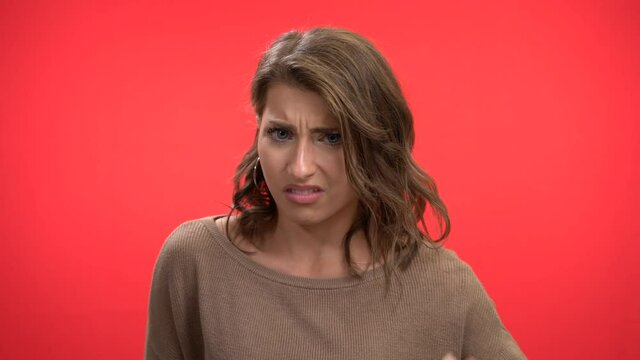 Stunning woman waves off in disgust what she is offered says no