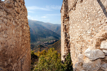 View of the Marisicani mounts through some old and abandoned buildings on the top of the mountain. 