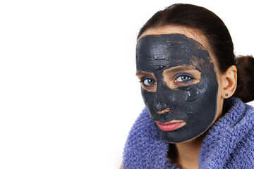 Girl with clay mud mask on face. Skin care, Spa treatments