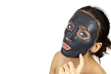 Girl with clay mud mask on face. Skin care, Spa treatments