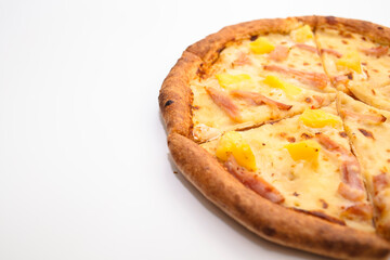 Hawaiian pizza with ham, cheese and pineapple isolated on white background