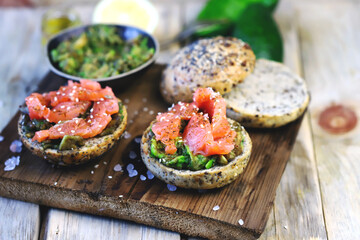 Salmon avocado sandwiches on healthy seed buns. Healthy snack. The keto diet.