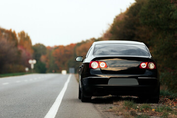 Fototapeta na wymiar black car on asphalt road