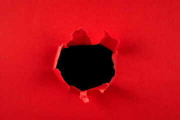 red Hole in the paper with torn sides. christmas background