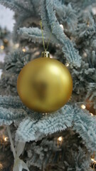 Golden ball on the tree. Christmas tree with balls, happy new year