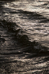Raging lake. White waves on the water.