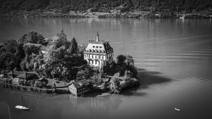 Seeburg Castle in Iseltwald Switzerland at Lake Brienz - aerial view