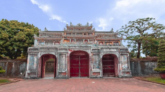 Hue Imperial City, Vietnam - time lapse of Walled stone fortress entrance. Summer cloudy day