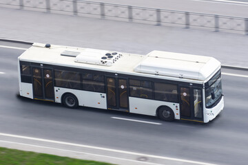 City bus travels on the highway, aerial view. © aapsky