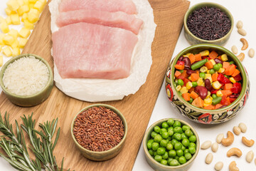 Turkey meat with vegetable mix. Black, brown and white rice in bowls