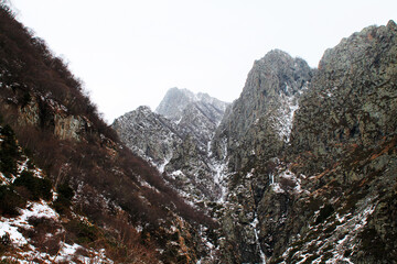 landscape with snow on the way to the frozen Gveleti waterfall. Georgia