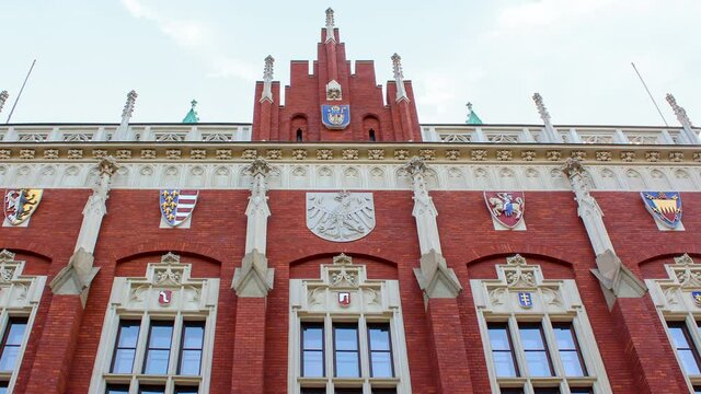 Krakow, Poland - Time lapse Collegium Novum in Cracow during a sunny cloudy day