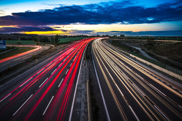 Colorful sunset at M1 motorway near Flitwick junction with cars light trails. United Kingdom © Pawel Pajor