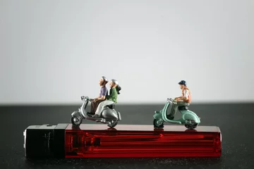 Selbstklebende Fototapeten miniature figure with a scooter © Agus Gatam