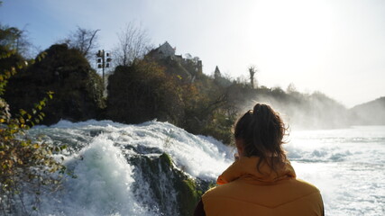person at waterfall
