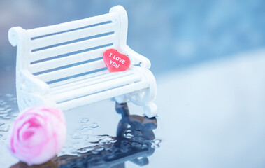 Valentines Day background,  The the white bench with red heart and rose on the water drops ...