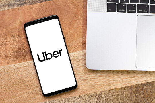 Uber logo on a smartphone screen, Uber app displaying on mobile