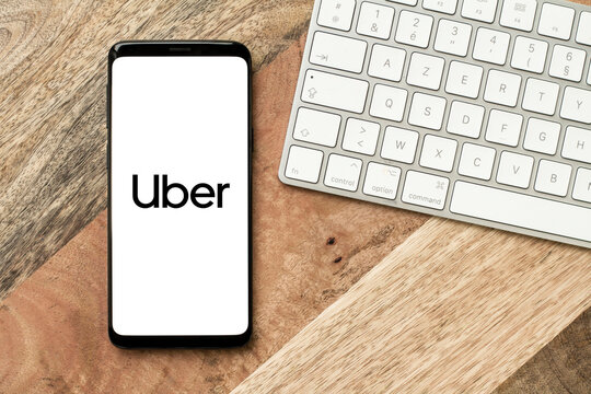 Uber logo on a smartphone screen, Uber app displaying on mobile