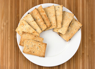 Pile of chocolate chip cookies on a dish.