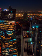 Fototapeta na wymiar Bangkok highrise office building and apartment with light illumination at night time.