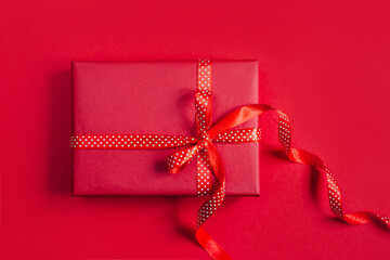 top view of gift box on red background