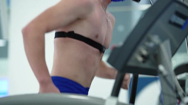 Triathlete runner man workout testing vo2 max in modern sport science lab