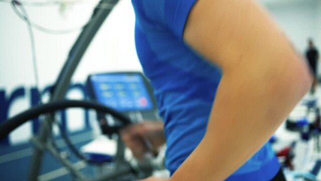 Triathlete runner man workout testing vo2 max in modern sport science lab