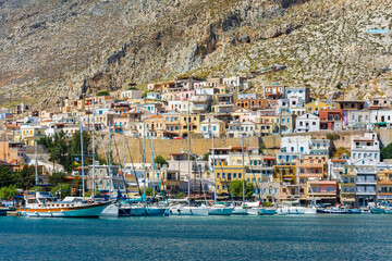 Fototapeta na wymiar Kalymnos harbour view from sea. Kalymnos Island is populer tourist destination in Greece. 