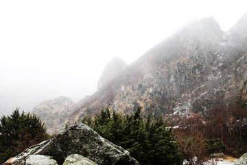 snow covered rocks On the way to the frozen Gveleti waterfall. Georgia