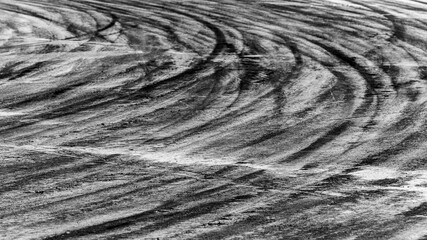 Abstract texture and background of car tire drift skid mark on road race track, Black tire mark on street race track, Automobile and automotive concept.