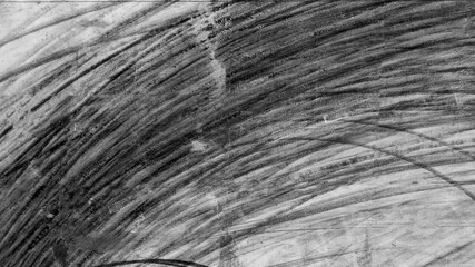 Aerial top view abstract texture and background of car tire drift skid mark on road race track,...